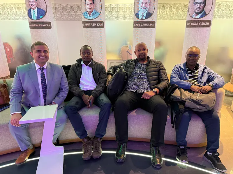 Participants seated in a lounge between training sessions