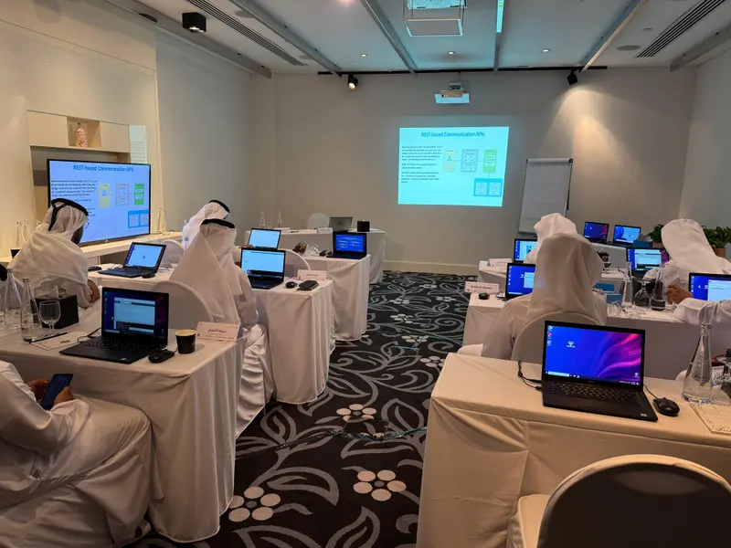 Training room with participants at laptops during a Teleriu classroom session