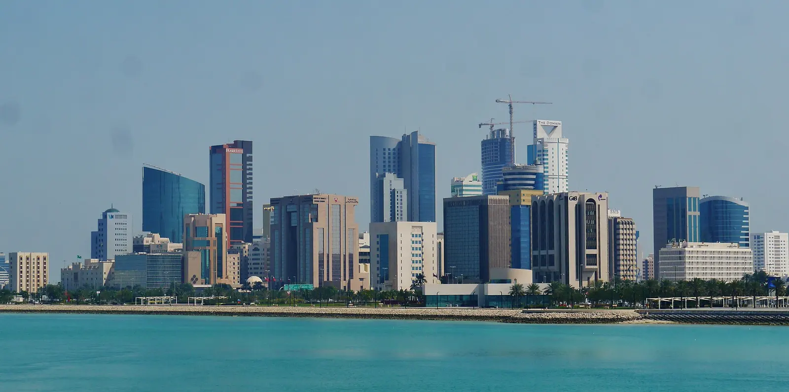 Manama skyline across turquoise water