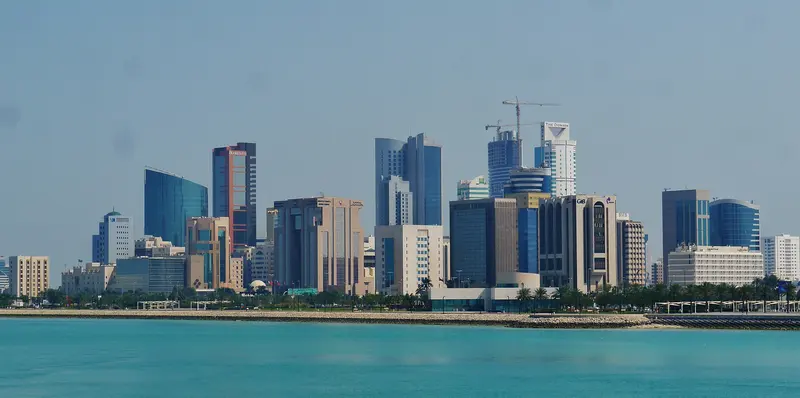 Manama skyline across turquoise water